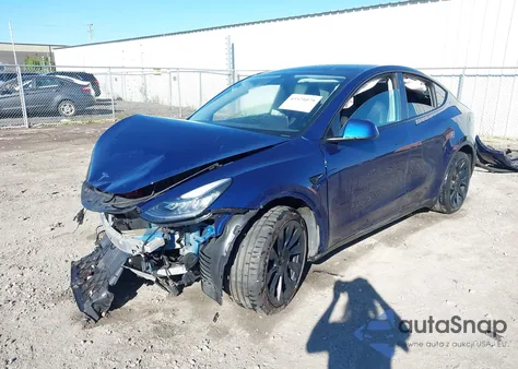 2022 Tesla Model Y Long Range Dual Motor All-Wheel Drive z USA, uszkodzony, nr VIN 7SAYGDEE0NF344188